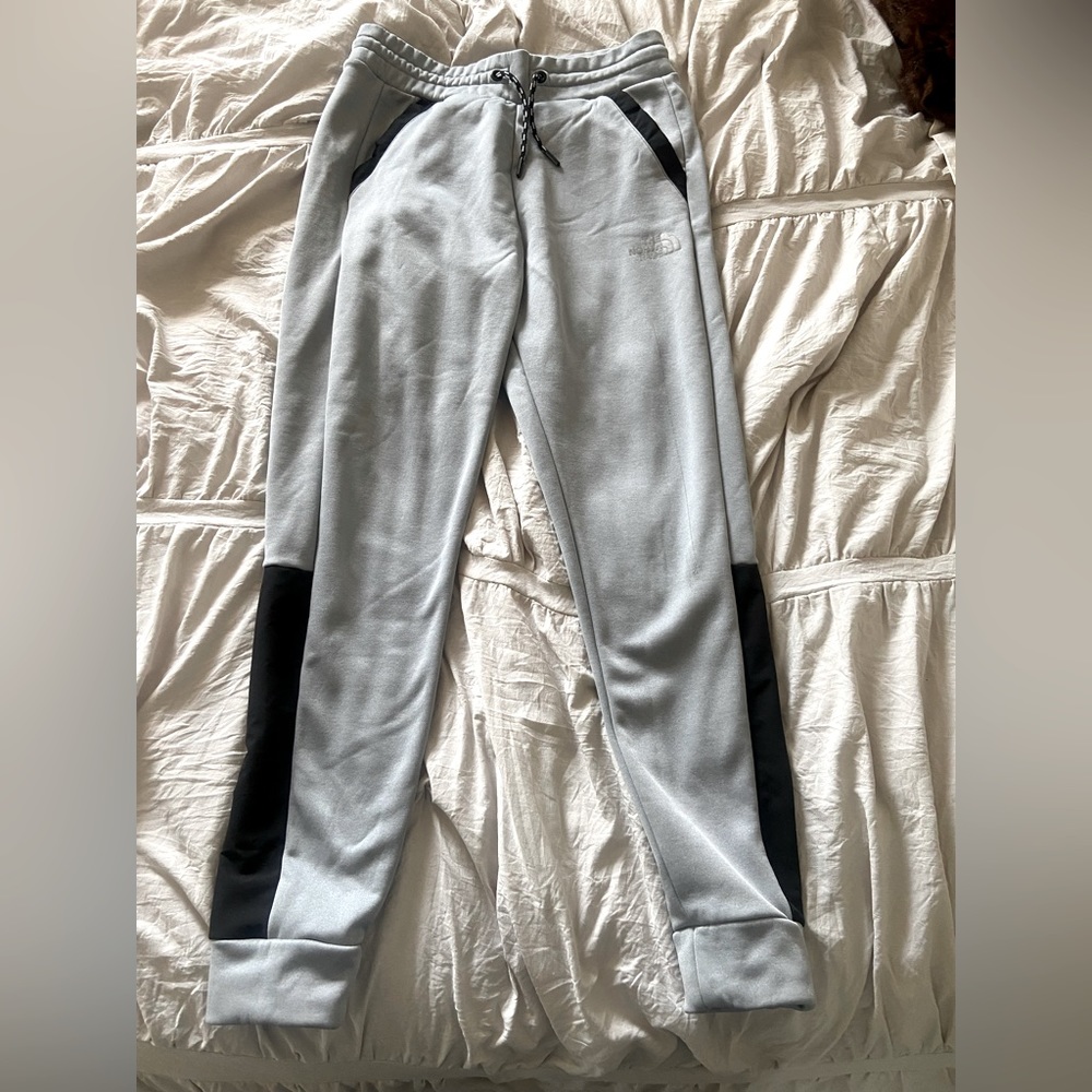 grey and black North Face womens sweatpants (size M)